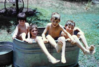 Donna, Gator, Corrine, and Jason in outdoor tub